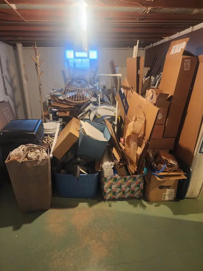 Roll-off dumpster container at job site for 2 Yard Dumpster Rental in Dedham